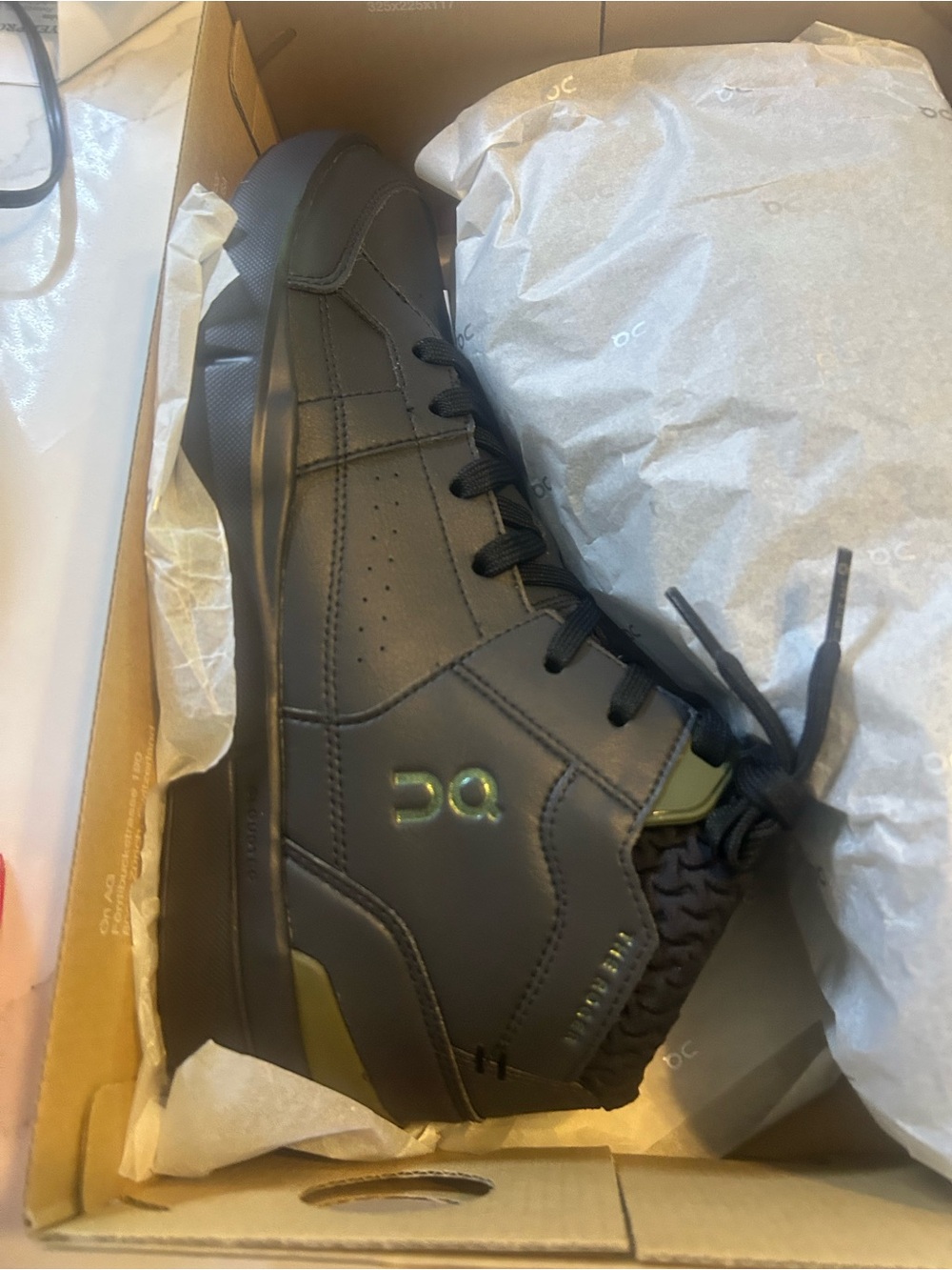 On Running Men’s Black Leather High-Top Sneaker with Olive Accents